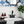 Load image into Gallery viewer, marble soap dish scalloped for large 6oz bar soap in a beautiful farmhouse bathroom with wainscoting and blue floral wallpaper black faucet and old black dresser sink.  essential oil liquid soap and lotion and an ikat blue and white turkish cotton hand towel
