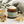 Load image into Gallery viewer, Jar of 'Grass Fed Tallow Balm' from The Little Flower Soap Co. on a neutral background with flowers and plants.
